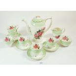 A Crownford vintage coffee set printed roses comprising coffee pot, six cups and saucers, milk and