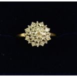 A 9 carat gold cluster ring set white stones, size Q to R