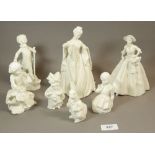 A collection of Royal Worcester figures of ladies and children in the white - unmarked