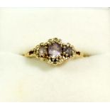 A 9 carat gold ring set three amethysts size O to P