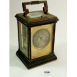 A fine French 19th century brass and black metal carriage clock with steel engraved face and