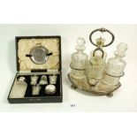 A silver plated and cut glass cruet stand and a silver plated communion set