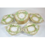 A Victorian apple green dessert service comprising four oval serving dishes and twelve plates (one