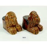 A pair of Victorian lion form pottery sash window rests