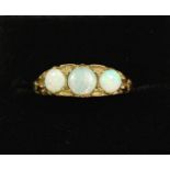 A 9 carat gold ring set three opals, size Q