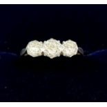 An 18 carat gold platinum ring set three diamonds, size N to O