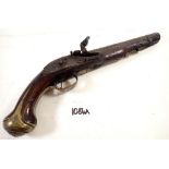 An antique flintlock pistol with brass mounts, impressed marks to barrel