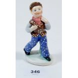A rare Hummel figure of a boy with polka dot trousers, cap and jerkin