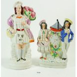 A Victorian Staffordshire figure man with grapes and another clock group with boat motifs