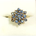 A 15 carat gold cluster ring set blue stones, size O to P