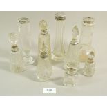 A group of cut glass and silver mounted vases, scent and toiletry bottles