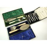 A silver plated nutcraker set and two pairs of Victorian silver plated fish servers (one with silver