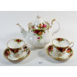 A Royal Albert 'Country Roses' tea service comprising: teapot, six cups and saucers, six tea
