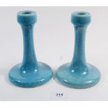 A pair of Ruskin pottery candlesticks with turquoise souffle glaze, 16cm