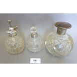 A silver plated and cut glass atomiser and two scent bottles