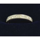 An 18 carat white gold half eternity ring set diamonds, size N/O, total weight 2.8g