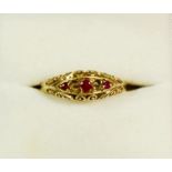 A 9 carat gold ring set rubies - two deficient, size L to M, 2.5g