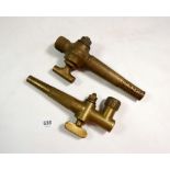 A pair of brass bar taps