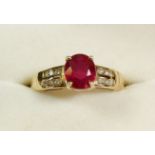 A 14 carat gold ring set ruby on diamond set shoulders,