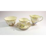 A 1930's Foley tea service printed garden flowers comprising: seven cups and saucers, two jugs,