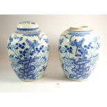A pair of Chinese blue and white ginger jars painted birds and tree peony - one lid only, 25cm tall