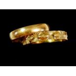 A 9ct gold wedding band, 1.7g and a 9ct gold eternity ring, 1.8g