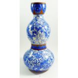 A Victorian Aesthetic Movement blue and white double gourd form vase, 45cm tall