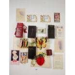 A group of miniature prayer books etc. and a small group of postcards, pop up cards, cigarette silks