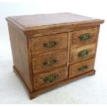 A small oak table top cabinet of six small drawers, 35.5 x 24.5 x 27 cm