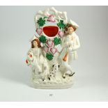 A Victorian Staffordshire watch stand with woman and dog, 30cm