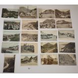 A box of postcards including Lee Post Office, Isle of Wight, Wales, Brimscombe Stroud etc