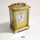A brass carriage clock 11cm tall