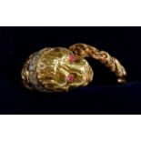 An 18ct gold ring in the form of a leopards head and tail set diamond collar and ruby eyes, size K-