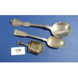 A silver teaspoon Newcastle 1865 by Thomas Seweell I, a silver shovel form caddy spoon Sheffield