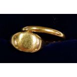 A 22ct gold wedding ring 3.2g and a gold signet ring unmarked 2.6g