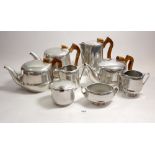 A group of Piquot ware, comprising three teapots, coffee pot etc