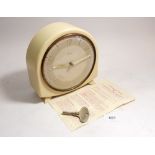 A Smiths Art Deco white Bakelite mantel clock with instructions and key