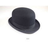 A Dunn & Co bowler hat, size 7