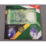 A commemorative folder with South African 10 rand banknote and 5 rand coin 2008 for Nelson Mandela