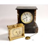 A Victorian black slate mantel clock and brass quartz one