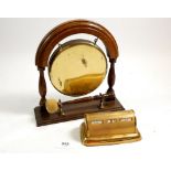 An oak and brass table gong and a vintage desk calendar
