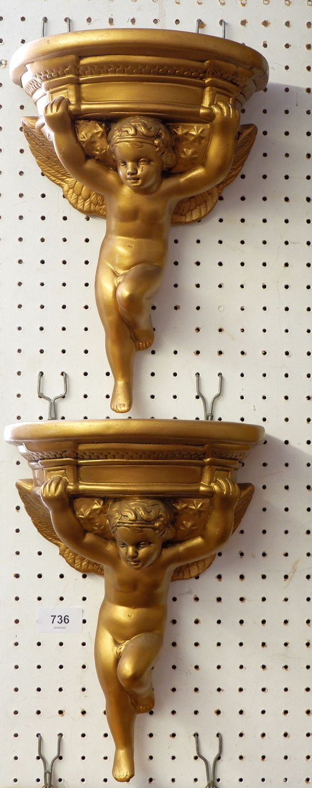 A pair of gilt plaster cherub wall brackets, 31 cm