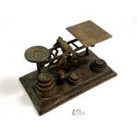A set of Victorian brass postal scales and weights