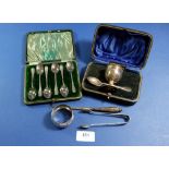 A silver egg cup and spoon, button hook, napkin ring and set of six silver coffee spoons