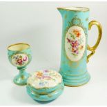 A Dresden porcelain tall jug, goblet and circular box, all painted flowers on a turquoise ground,