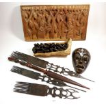 A group of tribal items including combs, mask etc