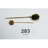 A Victorian 9ct gold stick pin set blue stone and a gilt metal scarab beetle stick pin