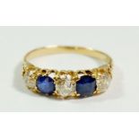 An 18 carat gold five stone sapphire and diamond ring (approx. total 1.5cts diamonds), size R, 4g