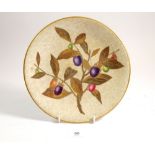A Worcester plate with embossed and gilt leaf and fruit decoration, 23cm, hairline crack