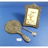 A silver framed mirror, photograph frame Birmingham 1901 20 x 14cm and a silver caddy spoon